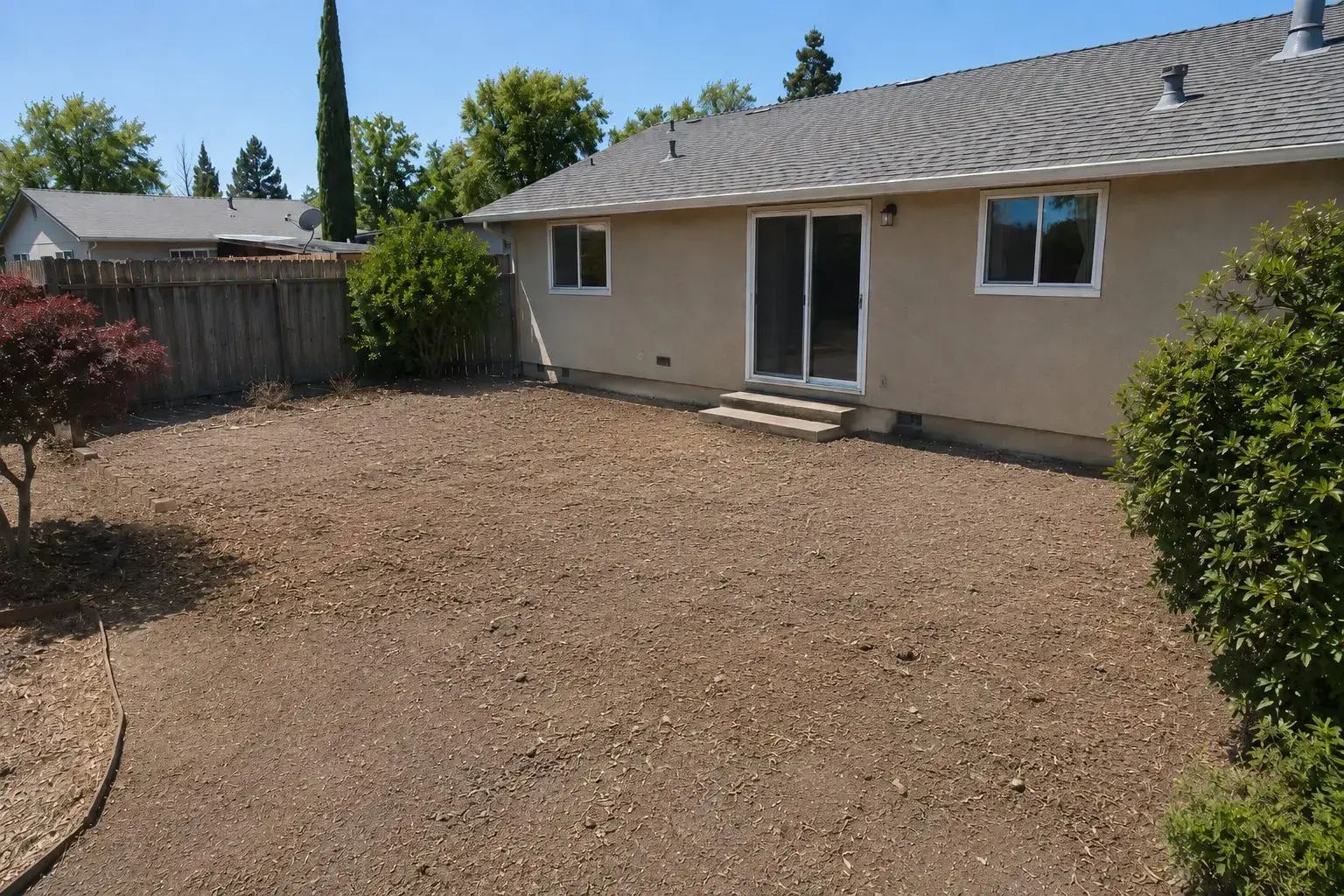 Cleared and graded patio area after demolition